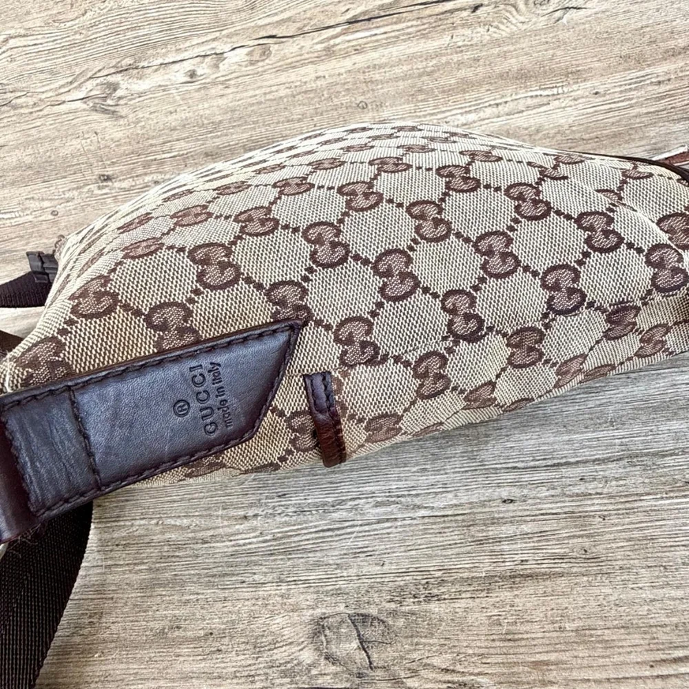 Gucci GG Monogram perforated leather messenger bag